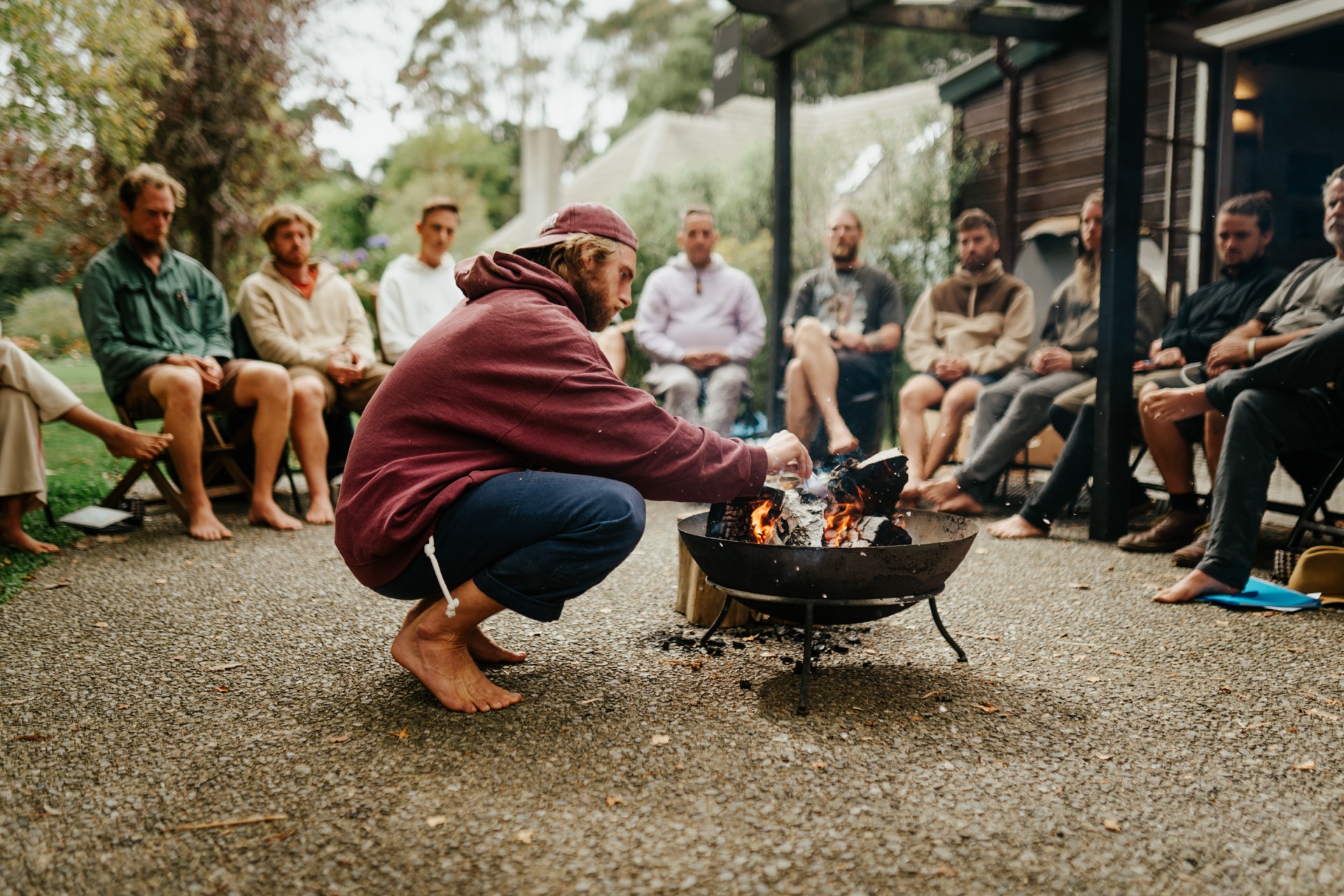 Man tending fire at BROS circle